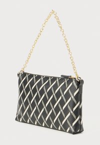 Black woven clutch bag with gold chain strap. Features a geometric pattern in silver and white. Made of textured material with zipper closure.