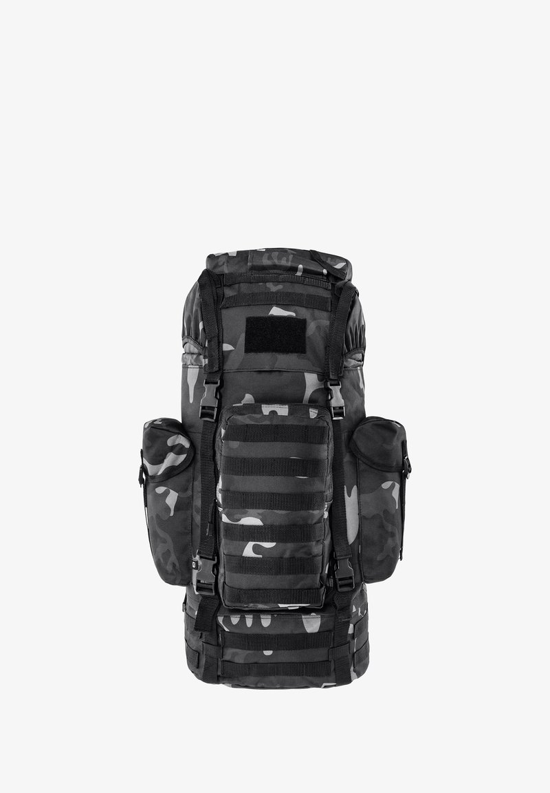 Sac à dos tactique camouflage noir et gris avec plusieurs compartiments zippés, bretelles ajustables et sangles MOLLE pour fixer du matériel.
