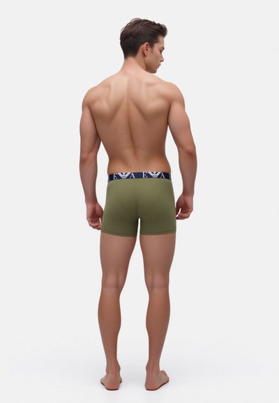 Olive green boxer shorts with a navy waistband featuring a logo. The fabric appears smooth and fitted, highlighting a streamlined design.