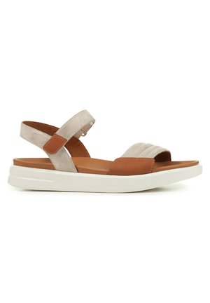 Sandalia de ante y cuero con parte superior beige, detalles en marrón, correa elástica y suela de goma blanca. Presenta una plantilla acolchada para mayor comodidad.