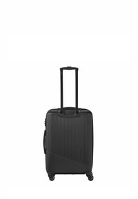 Black hard-shell suitcase with vertical ribbed texture, retractable handle, and four wheels for mobility. Edges have a slight angular design.