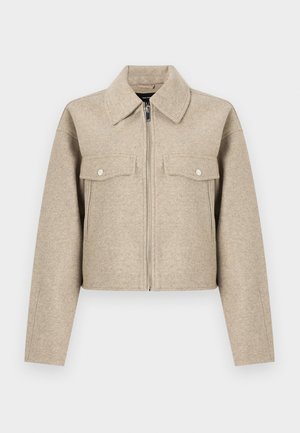 Beige cropped jack gemaakt van een wolmix, met een puntkraag, ritssluiting aan de voorkant en twee borstzakken met drukknoopsluiting.