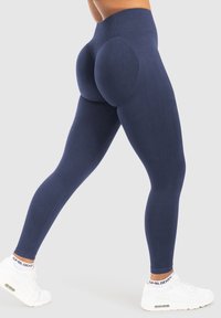 Marina höga leggings i sammetsliknande stretchtyg, med formande sömmar och böjda detaljer för en smickrande passform.