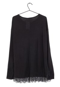 Schwarzes Langarmshirt mit runder Halslinie. Mit einer Spitze entlang dem unteren Saum, die Textur und Detail verleiht. Aus weichem Stoff gefertigt.