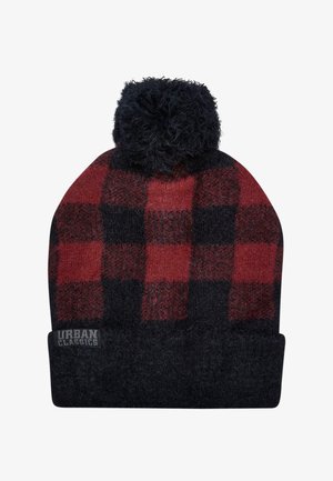 Czapka beanie dzianinowa w czerwono-czarną kratę z puszystym czarnym pomponem na czubku i czarnym złożonym mankietem z logo.