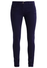 Navy blue skinny jeans made of stretchy cotton blend fabric. Features include five pockets and a front button closure.