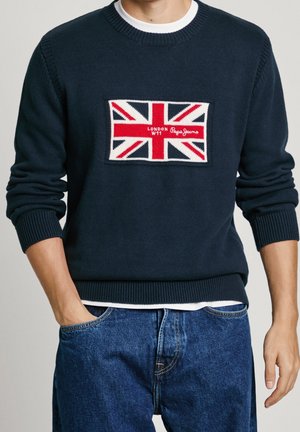 Marineblå strikket sweater med et Union Jack-design på forsiden, der har en rektangulær lap samt ribstrikkede manchetter og kant.