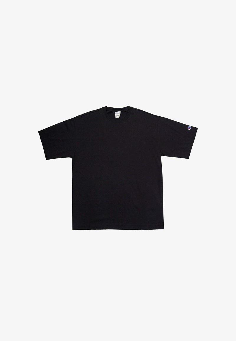 Maglietta nera oversize in cotone con maniche corte e scollo rotondo. Presenta un piccolo logo sulla manica sinistra.