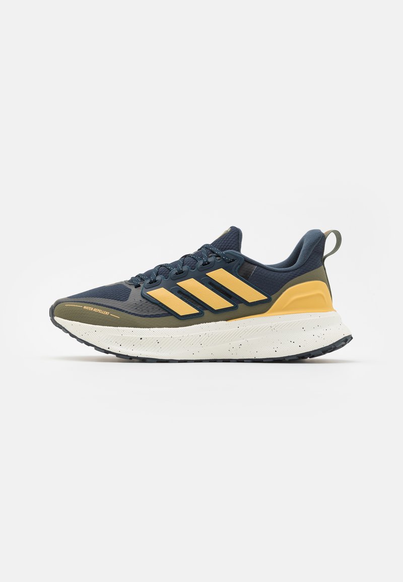 Navy blue athletic shoe with yellow accents, featuring a textured upper, a cushioned sole, and a speckled midsole. Water-repellent material.