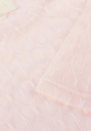 Light pink cable knit fabric with a diamond pattern and ribbed knit edges, showing part of a folded garment.
