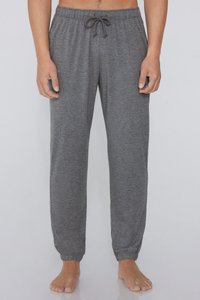 Grau Sweatpants aus einem weichen, strukturierten Stoff. Verfügt über einen elastischen Bund mit Kordelzug und schmal zulaufende Bündchen an den Knöcheln.