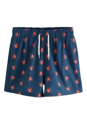 Granatowe spodenki kąpielowe z elastyczną talią i białym sznurkiem, ozdobione wzorem małych czerwonych ośmiorniczki na całej powierzchni.
