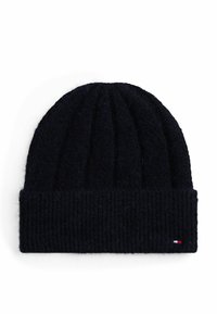 Knit beanie in dark navy, featuring ribbed texture and fold-over cuff. Small logo tag at the side. Soft, warm material.
