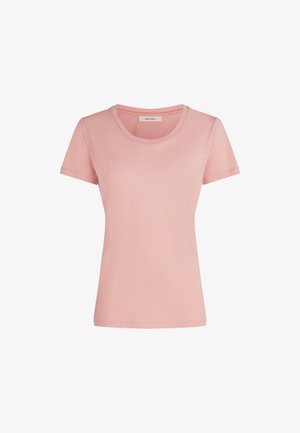 T-shirt aderente a maniche corte di colore rosa chiaro con tessuto morbido e un piccolo etichetta all'interno del collo.
