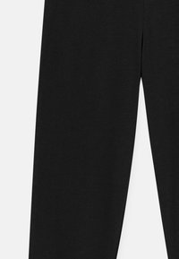 Black cotton pants, featuring a straight leg design and smooth texture. The fabric has a consistent color with no visible patterns or accents.