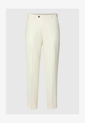 Kreemikad kohandatud püksid nööbiga kinnituse ja küljetaskutega, esitletud ühevärvilise tausta ees.