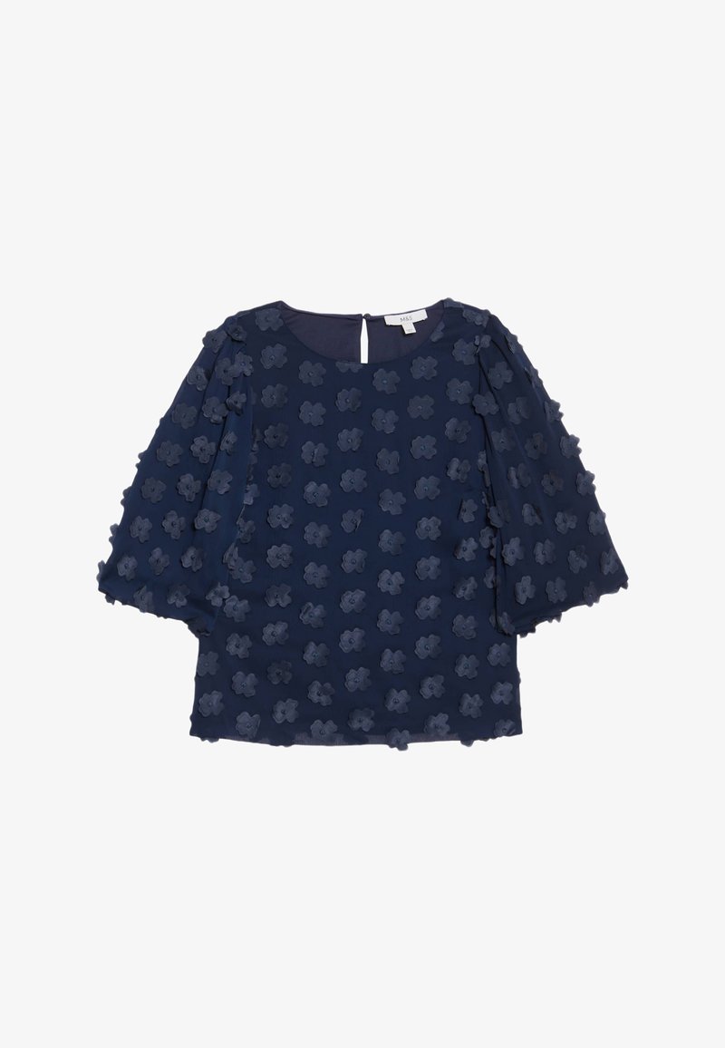 Dunkelbluse mit kurzen, ausgestellt geschnittenen Ärmeln, die ein strukturiertes florales Muster aufweisen. Rückseitige Aussparung mit Knopfverschluss.