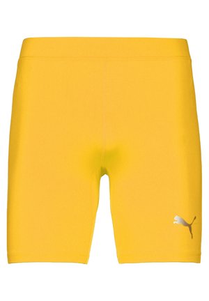 Gelbe Sportsch shorts aus dehnbarem Material. Eng anliegendes Design mit glatter Textur. Verfügt über ein kleines silbernes Logo an der unteren Seite.