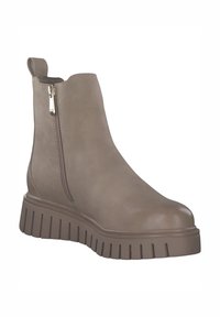 Bottine taupe avec une surface lisse, fermeture éclair sur le côté et une semelle épaisse et crantée. Comprend un bout arrondi et une languette au talon pour un enfilage facile.