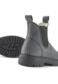 Gray leather Chelsea boots with elastic side panels, back pull tabs, and a rugged black treaded rubber sole. Stitching visible on upper.