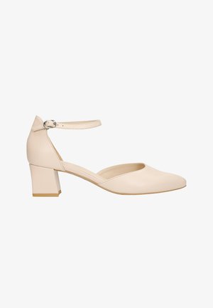 Soulier en cuir beige à bout rond, avec une bride à la cheville et un talon block. Texture lisse et design minimaliste sans motifs ou accents supplémentaires.