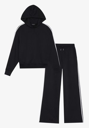 Black hoodie with a hood and white side stripes, paired with matching black track pants featuring an elastic waistband and drawstring.