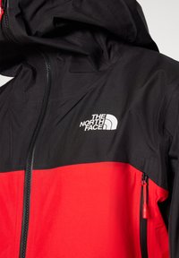 JAZZI JACKET - Hardshell jacket - high risk red/black