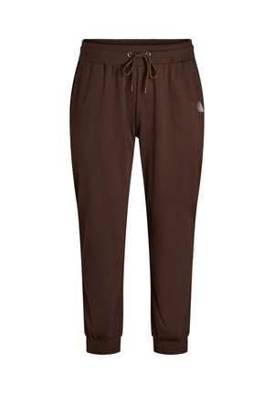 Brązowe spodnie dresowe z elastycznym pasem, sznurkiem do regulacji, bocznymi kieszeniami, ściągaczami przy kostkach oraz małym białym logo na lewej stronie uda.