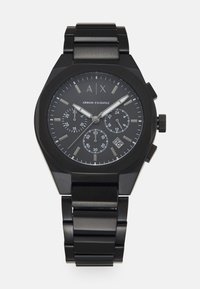 Orologio in acciaio inossidabile nero con cassa ottagonale, quadrante nero, dettagli argentati, tre sotto quadranti e visualizzazione della data alle 4.