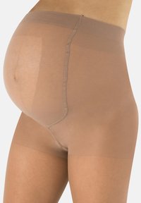 Beżowe rajstopy ciążowe z gładką fakturą i szerokim, elastycznym pasem, zaprojektowane z myślą o rosnącym brzuszku.