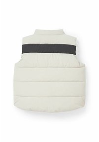 Jasny, pikowany kamizelka z czarnym poziomym paskiem na klatce piersiowej, z wysokim kołnierzem i bez rękawów. Miękka w dotyku.