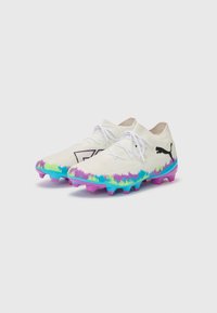 White football boots with a knitted design. Colorful gradient accents in blue, green, and purple on the sole, featuring standard laces and a logo.