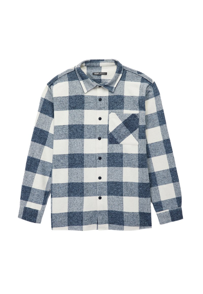 Skjorte med knapstribe i marineblå og hvidt ternet mønster. Flannelstof med lange ærmer, spidse krave og en enkelt brystlomme. Sorte knapper.