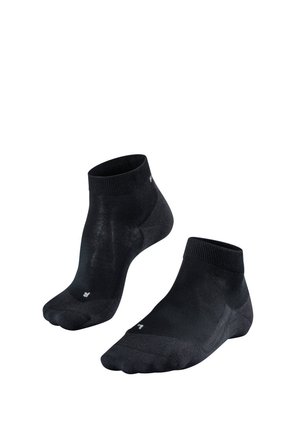 Chaussettes noires montantes en matériau lisse et extensible. Présentent des bords côtelés et un léger logo sur le côté.