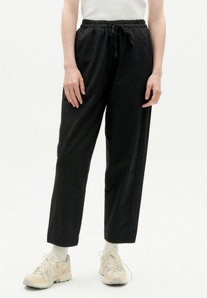 ESTHER - Trousers - black