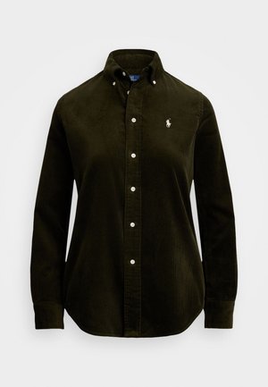 Camicia di velluto a coste verde scuro con maniche lunghe, colletto button-down, bottoni bianchi e un piccolo logo ricamato sul petto.