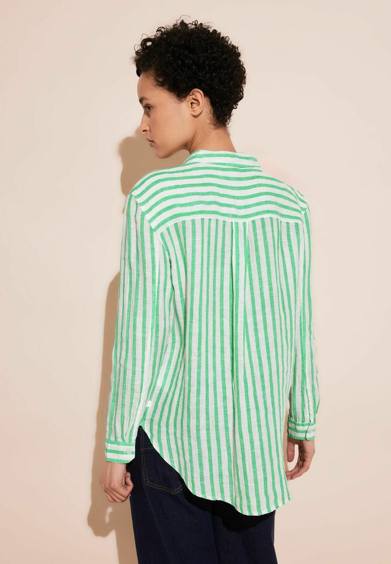 Green and white striped long-sleeve shirt made of lightweight fabric, featuring a button closure, curved hem, and a back yoke detail.
