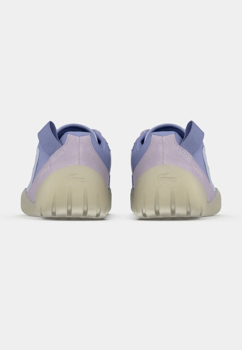 Purple and light lavender athletic shoes with a textured upper, low-profile design, and translucent rubber soles featuring horizontal grooves.