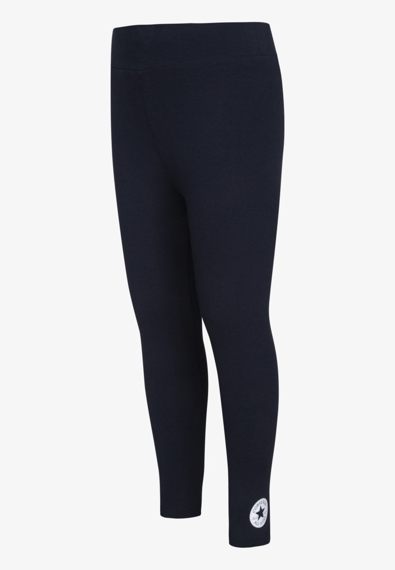 Marine leggings med elastisk midje, glatt tekstur og en logo patch nær anklene. Fitted form, egnet for aktivt bruk.