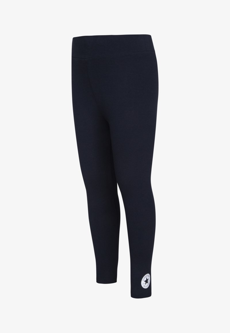 Marine leggings med elastisk midje, glatt tekstur og en logo patch nær anklene. Fitted form, egnet for aktivt bruk.