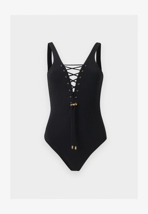 Maillot de bain une pièce noir avec larges bretelles, détail lacé à l'avant, œillets et embouts de cordon dorés sur fond blanc.