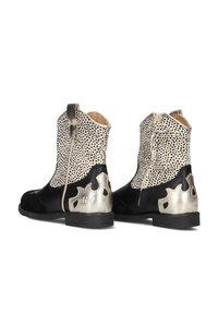 Black and white polka dot leather ankle boots with metallic tan accents, rear zipper, flame-like cutouts, and a low stacked heel.