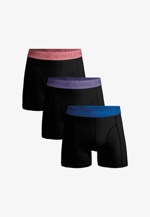 Zwarte boxershorts met contrasterende taillebanden in roze, paars en blauw. Het materiaal lijkt zacht, met gestikte naden en "MUCHACHO MALO" branding.