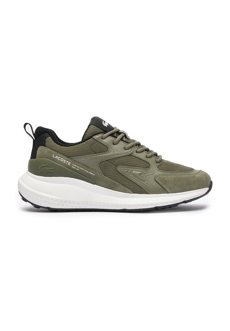 Olive green sneaker with mesh and suede panels, white midsole, black accents, and textured grip sole. Lace-up design with logo detail.
