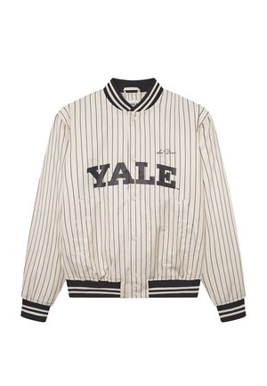 White satin bomber jacket with black vertical stripes, featuring "YALE" in bold lettering, ribbed black cuffs, and a snap-button closure.
