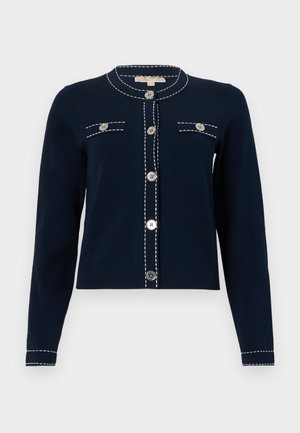 Navy blue cardigan with long sleeves, front buttons, white stitching details along edges, and two decorative buttoned chest pockets.