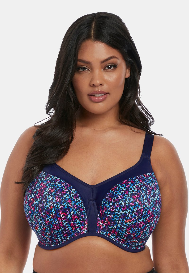Bralette met onderdraad in een geometrisch patroon in levendige roze, blauwe en paarse tinten. Heeft marineblauwe accenten en verstelbare bandjes.