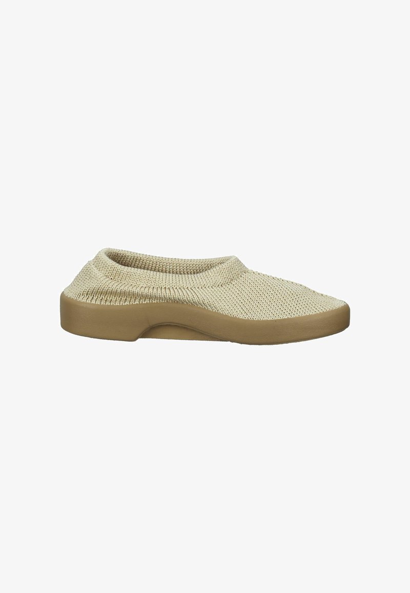 Beige knit slip-on shoe with a soft, textured upper and a solid tan rubber sole. Minimalistic design with no visible hardware or patterns.