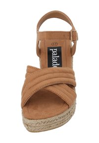 Tan espadrille sandal featuring crossed fabric straps, a buckle closure, and a jute-wrapped platform sole. Flat footbed, size 37.