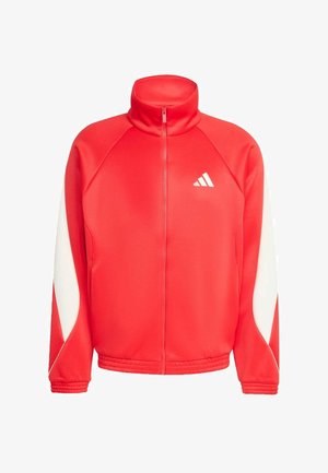 Casaco atlético vermelho com fecho éclair, colarinho alto, painéis laterais brancos e tecido texturizado. Apresenta um pequeno logótipo branco no peito.